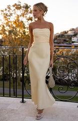 A strapless cream-colored maxi-dress with a ruched bodice and a flowing satin-like skirt that flares slightly at the bottom. Our elegant dress is suitable for a formal event.