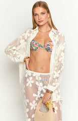 holding a drink and posing