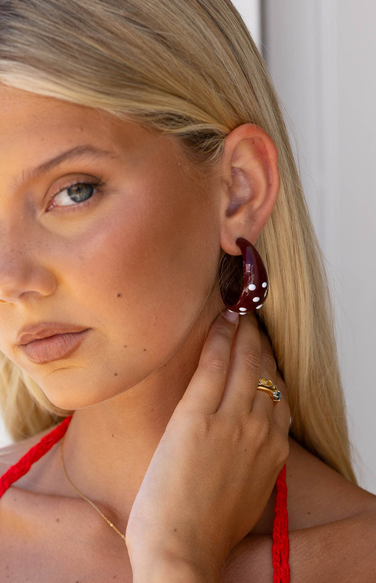 The Norah Burgundy Polka Dot Chunky Hoop Earrings a pair of fun statement earrings to elevate a casual or party outfit.