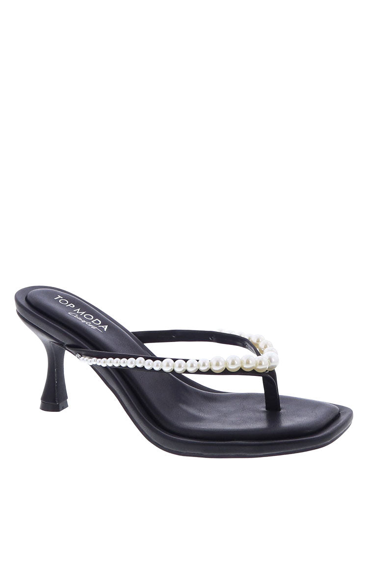 A pair of black low heels with a thong strap pearl details and a modern square toe.