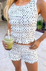 A white shorts with a black polka dot pattern