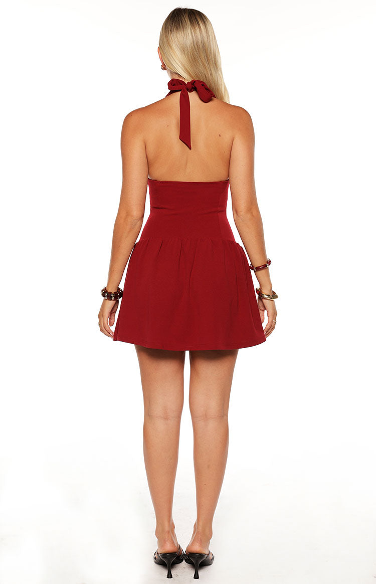 Model in the Alice Burgundy Halter Neck Mini Dress a sophisticated crepe dress with a V neck perfect for homecoming or a cocktail party.