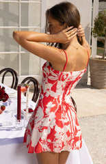Model wears the Bellie Red Floral Mini Dress a cute summer outfit perfect for daytime events or a casual party. The dress features a sweetheart neckline and an A-line skirt for a flattering fit.