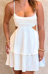 white mini dress with gathered bust detail and layered hem styled on brunette model