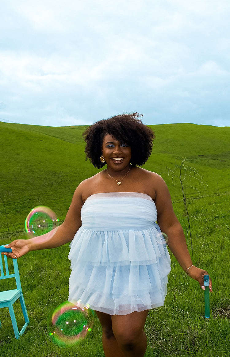 Blue strapless ruffled mini dress.
