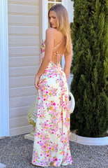 Yellow satin maxi dress with an all-over pink and orange floral print- featuring thin spaghetti straps and a criss-cross lace-up back detail.
