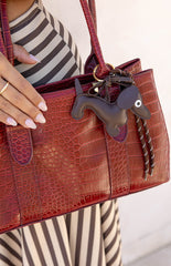 The Dachshund Braided Bag Charm in a chocolate brown colour a cute accessory to add personality to any handbag or purse.