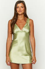Sage green satin mini dress on brunette model