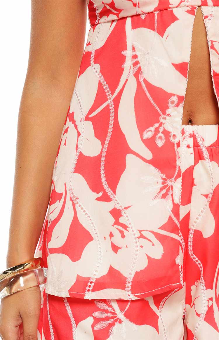 A close up view of the Gypsy Red Floral Strapless Top showing the open bodice detail making it a perfect top for a date night or party.