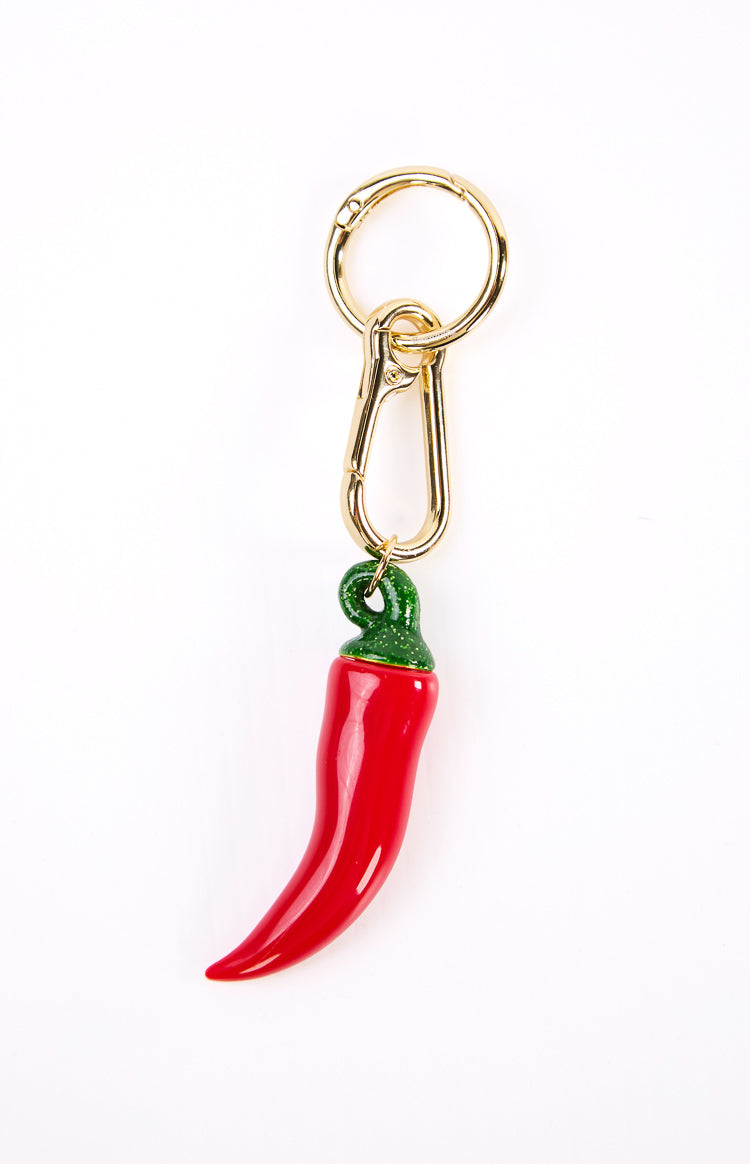A red chilli shaped bag charm with a gold chain and clasp. This quirky accessory is a fun way to decorate a handbag. A perfect gift to spice up a festival outfit or everyday look.