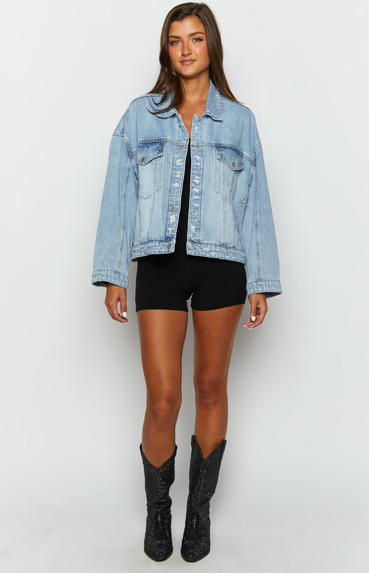 light wash oversized denim jacket with silver buttons on brunette model