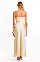 The back of a yellow strapless formal gown is shown on a girl. This evening dress highlights a beautiful satin material. A timeless and elegant option for prom or a special occasion.