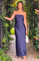 brunette model wearing a navy blue strapless dress