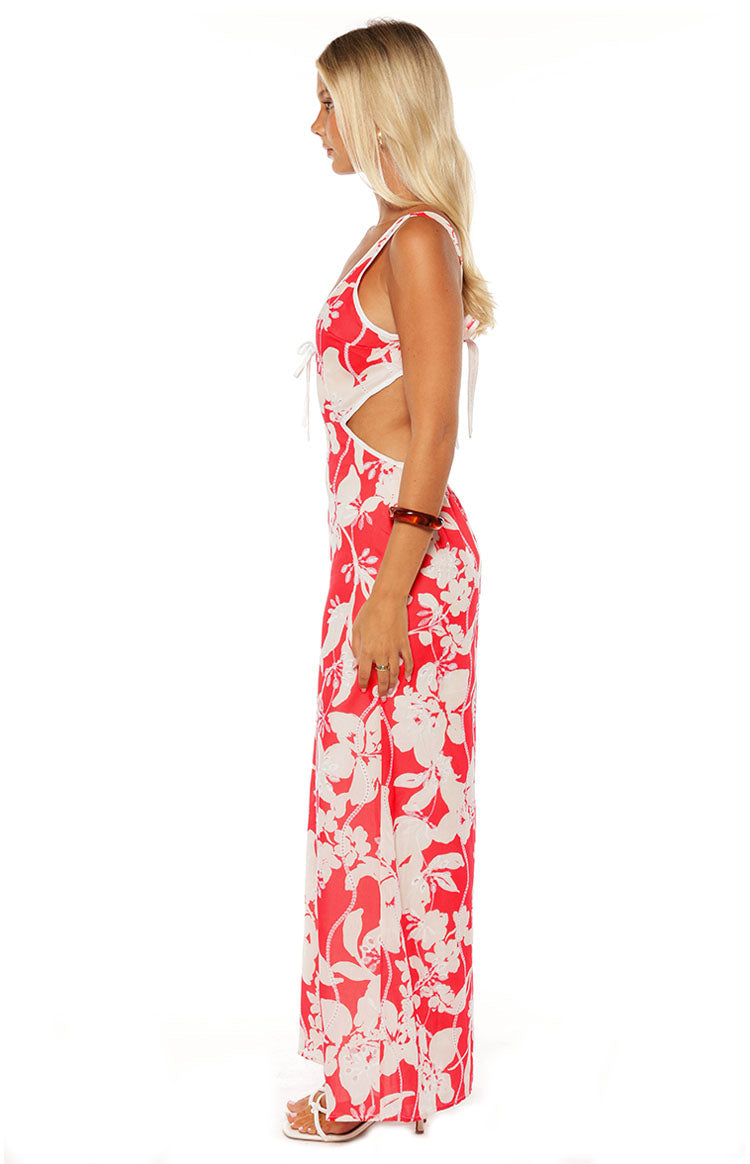 Model in the Perez Red Floral Cut Out Maxi Dress a beautiful choice for a wedding guest or a summer formal event.