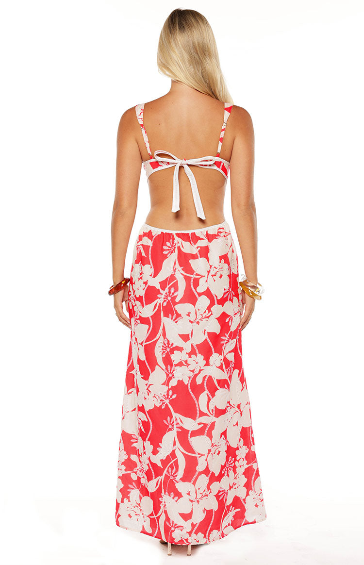 Model in the Perez Red Floral Cut Out Maxi Dress a beautiful choice for a wedding guest or a summer formal event.