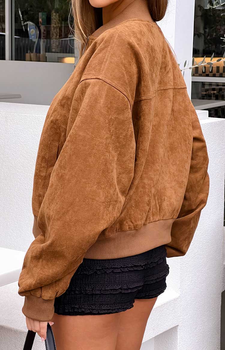 Girl in a cropped tan faux suede jacket a perfect casual outerwear piece.