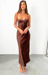 Brunette model wears brown satin maxi dress with underwire bra cups.