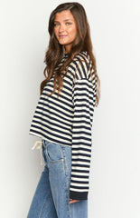 Model wearing a black and white striped long-sleeve top