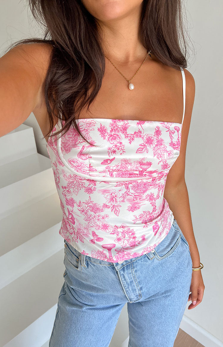 Pink printed top with low back cut on a brunette model