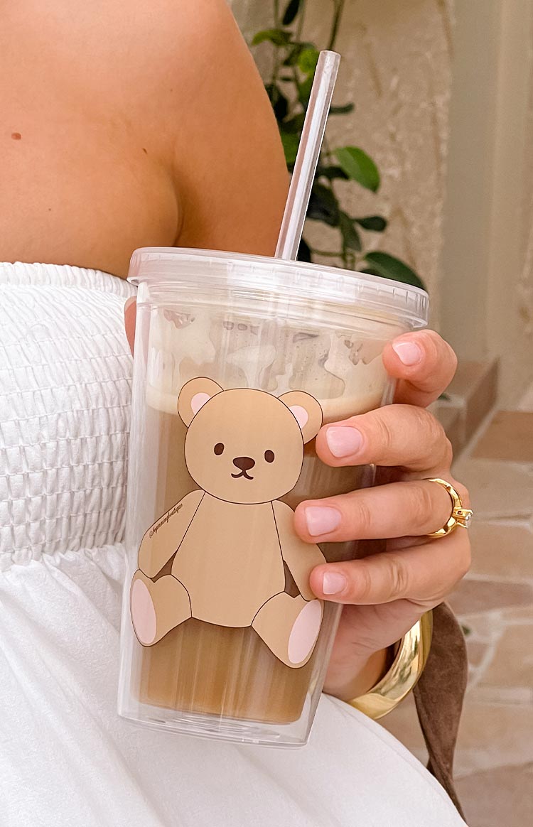 clear plastic tumbler cup with teddy graphic and straw