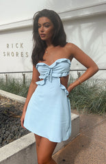Blue strapless mini dress with cut out detailing on the side on brunette model