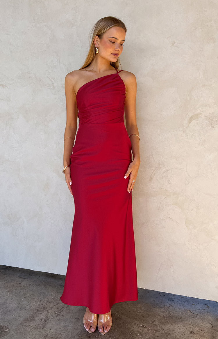 Blonde model wearing red maxi dress and clear high heels.