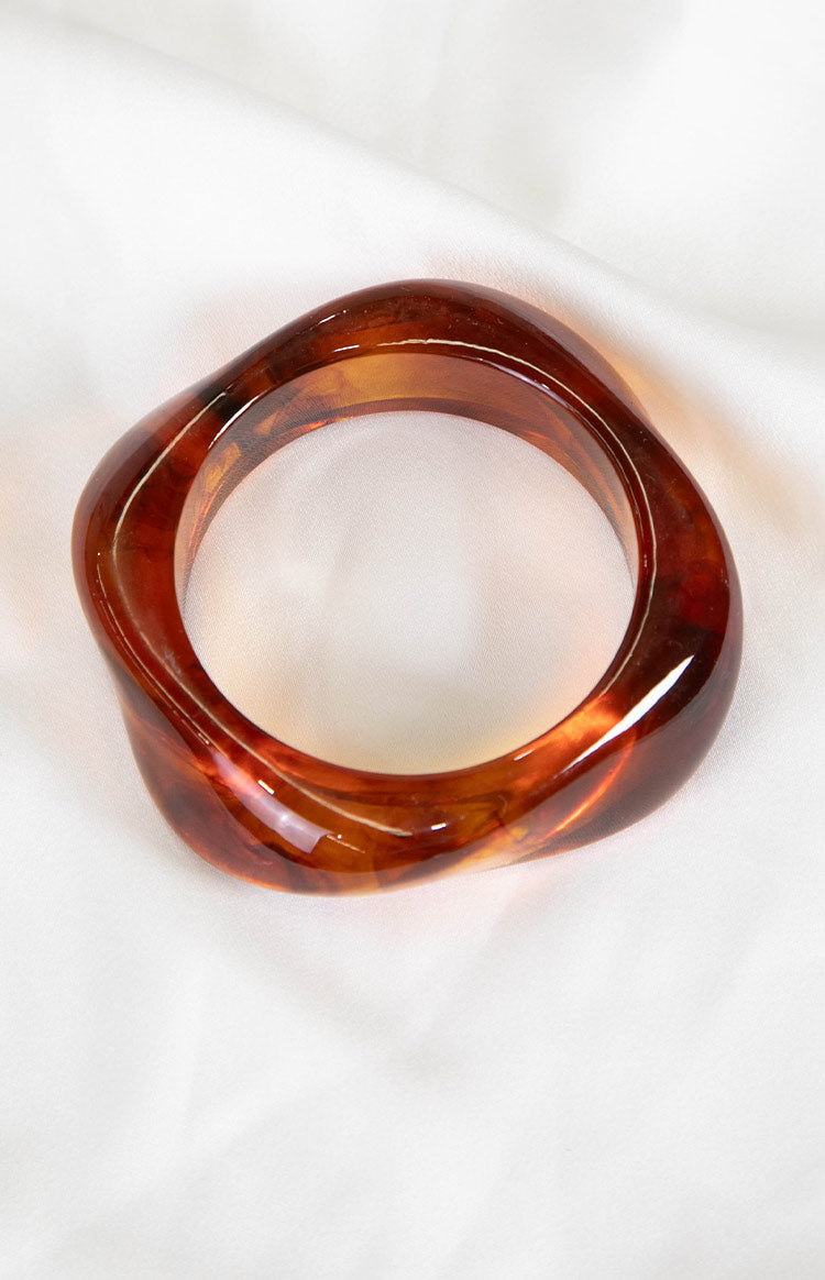 The Zantie Tortoiseshell Resin Square Bangle a timeless accessory to elevate any outfit.